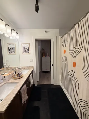 a bedroom with a bed and a table in it