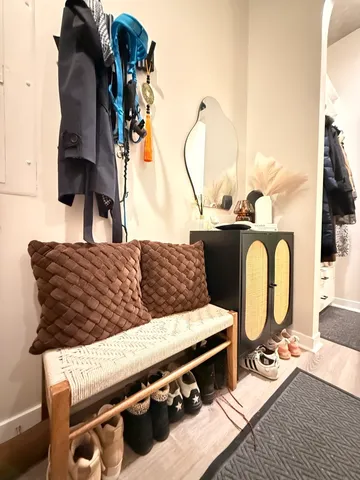 a living room with furniture and floor to ceiling window