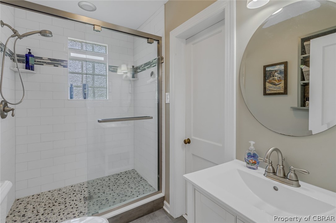 314 Callis Road Lancaster, VA 22503 - Photo 24 of 41 a bathroom with a shower and a sink