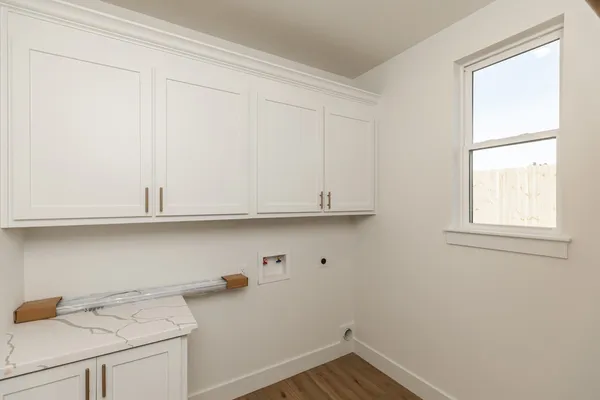 a view of storage area and utility room