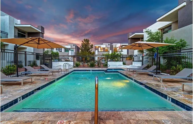 a view of a swimming pool with a patio