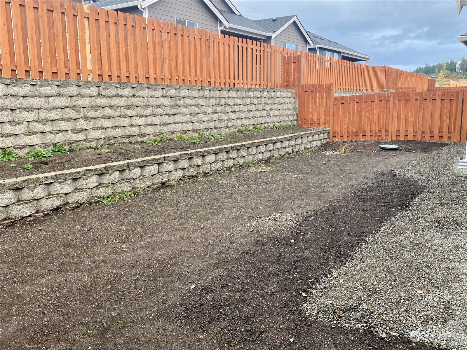 2740 Arrowroot Street Southeast Lacey, WA 98513 - Photo 5 of 15 a view of a backyard with wooden fence