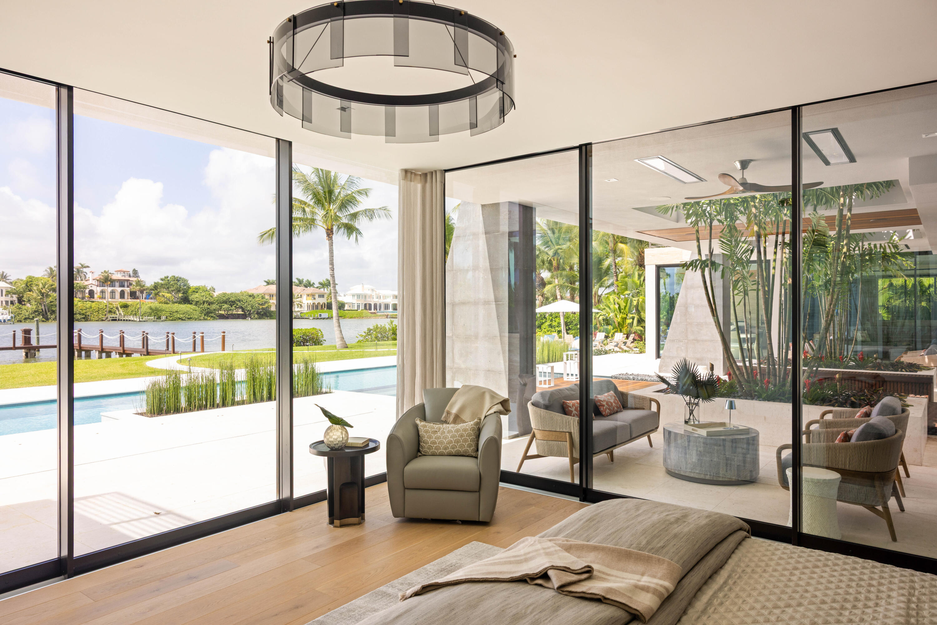 488 South Beach Road Jupiter Island, FL 33455 - Photo 28 of 54 a living room with furniture and a floor to ceiling window
