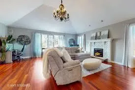 a living room with furniture and a fireplace