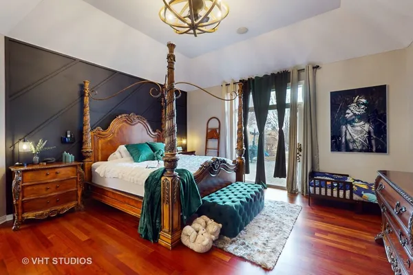 a bedroom with furniture and wooden floor