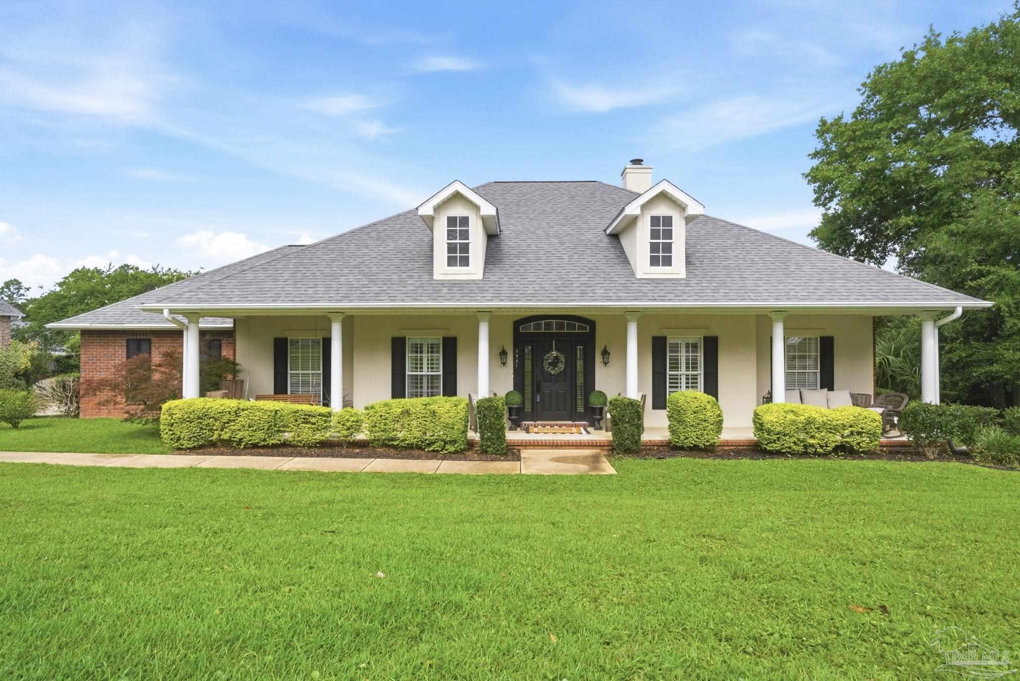 5931 Otter Point Road Pensacola, FL 32504 - Photo 1 of 67 a front view of a house with a yard