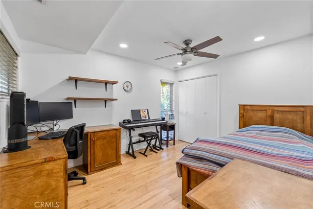 a bedroom with a workspace