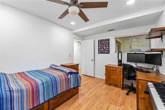 a bedroom with bed and a window