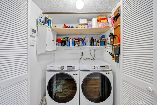 a bed room with a bed and a ceiling fan