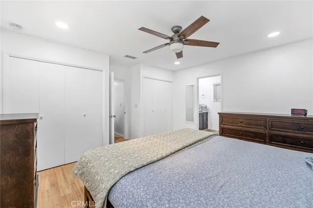 a bedroom with a bed and a dresser