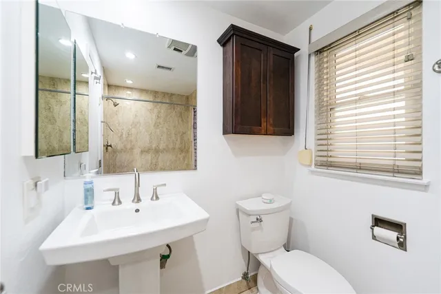 a bathroom with a double vanity sink and mirror