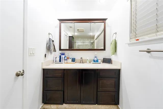 a bathroom with a toilet and shower