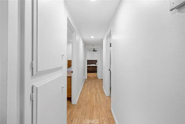 a view of a backyard with table and chairs and wooden fence