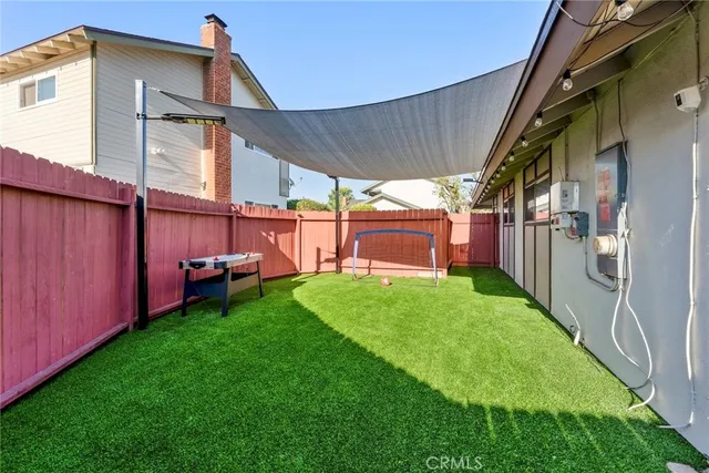 a view of a backyard with a sitting area