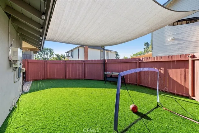 a patio with table and chairs