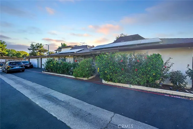 a view of a street with a garage