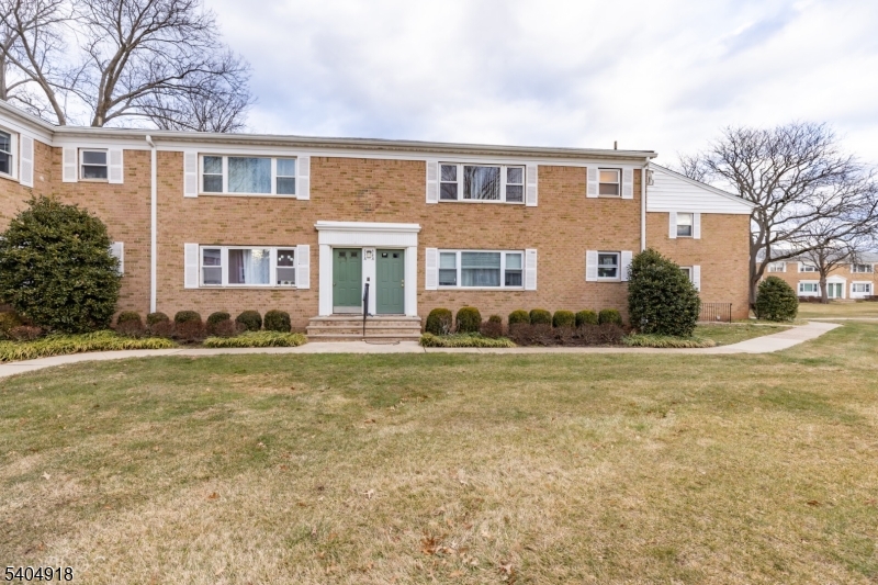 187 Evergreen Road Edison, NJ 08837 - Photo 1 of 8 a front view of house with yard and trees around
