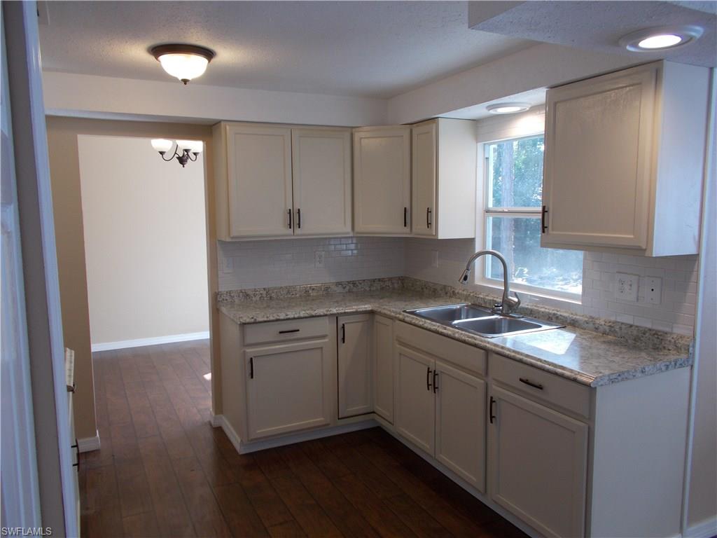 4180 Pine Ridge Road Naples, FL 34119 - Photo 15 of 25 PLENTY OF NATURAL LIGHT WHILE PREPARING YOUR MEALS, EASY WALK WAY TO YOUR DINING AREA
