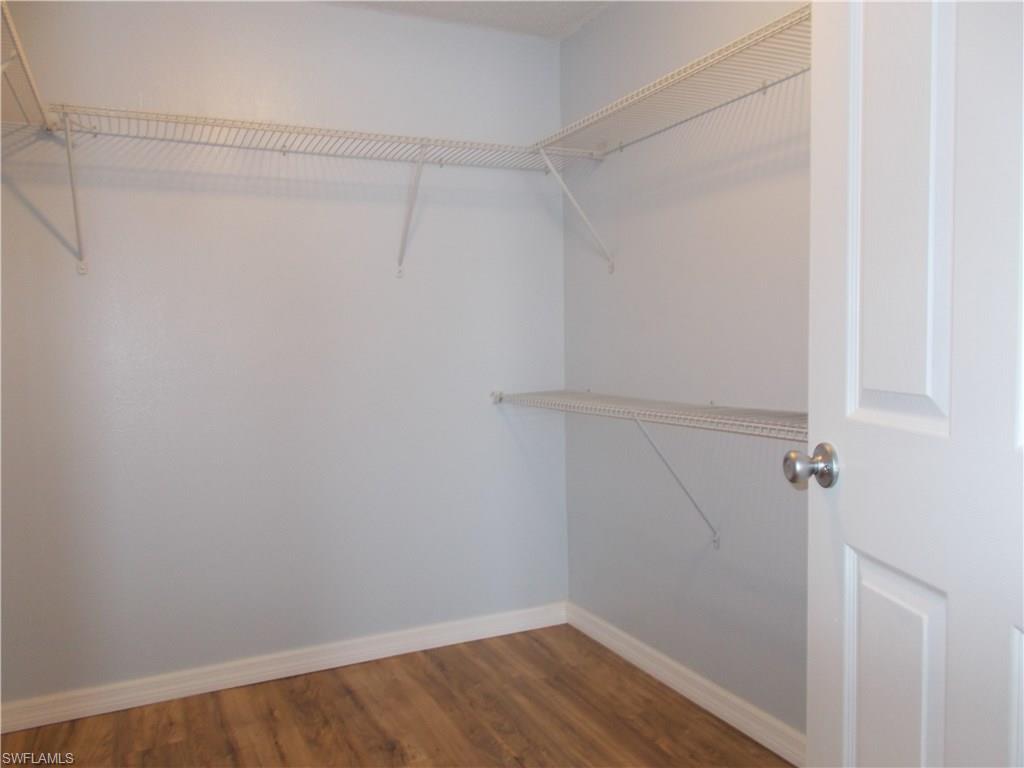 4180 Pine Ridge Road Naples, FL 34119 - Photo 19 of 25 VERY SPACIOUS WALK IN CLOSET IN YOUR MASTER BEDROOM CLOSET