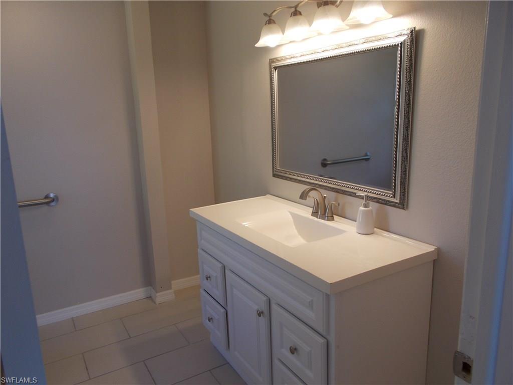 4180 Pine Ridge Road Naples, FL 34119 - Photo 20 of 25 SPACIOUS MASTER BATHROOM WHICH IS RIGHT OFF OF THE MASTER BEDROOM