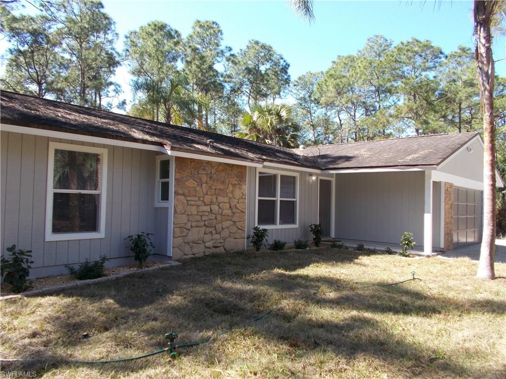 4180 Pine Ridge Road Naples, FL 34119 - Photo 2 of 25 NEWLY PAINTED HOME, NEWLY PLACED SOD AND NEWLY LANDSCAPED HOME