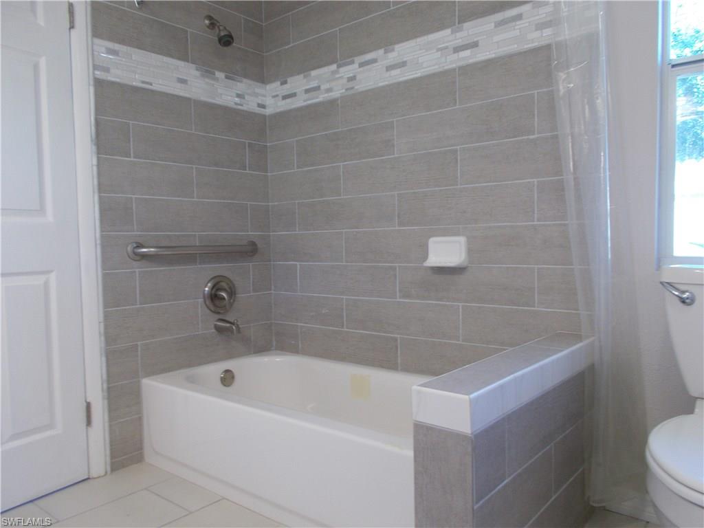 4180 Pine Ridge Road Naples, FL 34119 - Photo 22 of 25 VERY NICELY DECORATED MASTER BATHROOM AREA