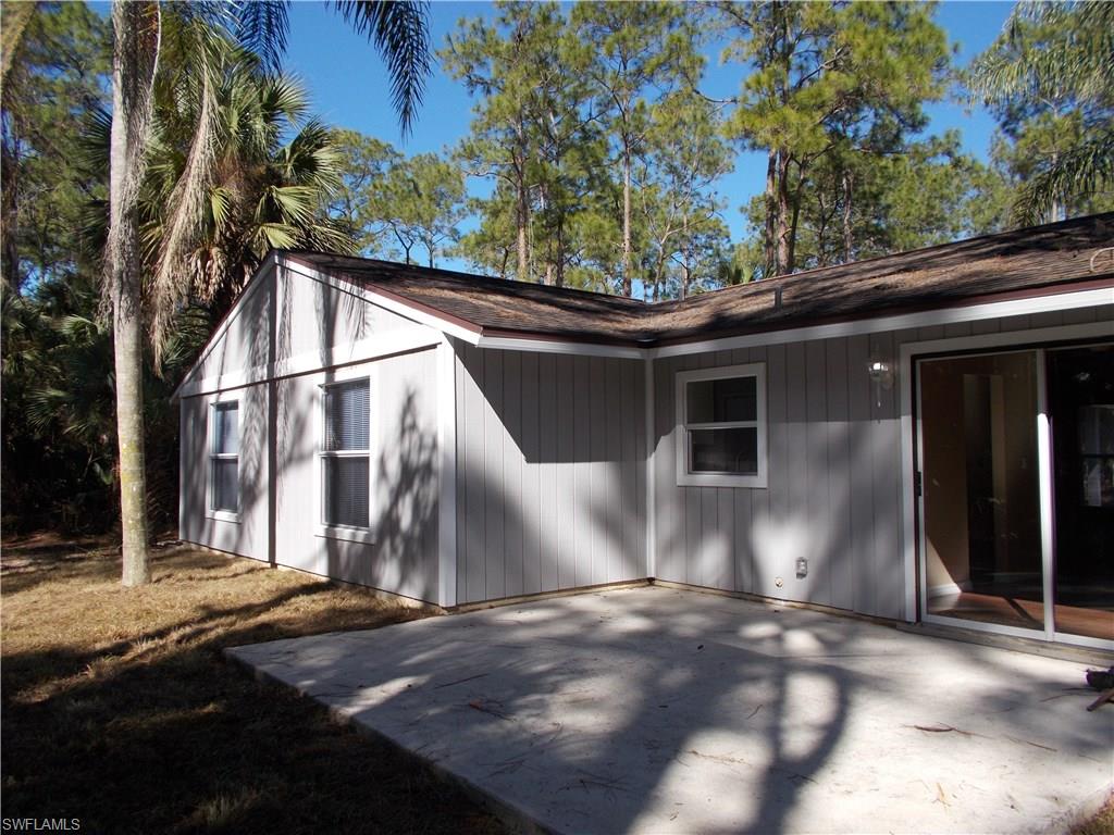4180 Pine Ridge Road Naples, FL 34119 - Photo 24 of 25 SET UP A PICNIC TABLE OFF OF THE BACK OF THE HOME FOR FAMILY COOKOUTS