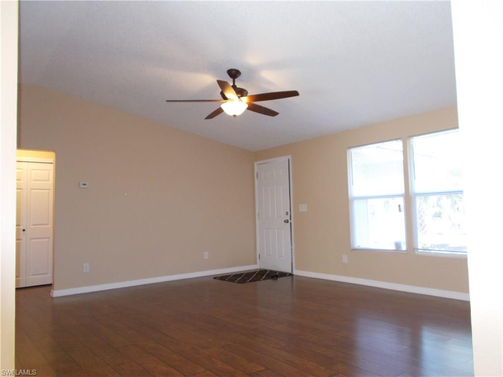 4180 Pine Ridge Road Naples, FL 34119 - Photo 3 of 25 ENTRANCE TO YOUR NEW HOME WITH PLENTY OF NATURAL LIGHT AND CATHEDRAL CEILING
