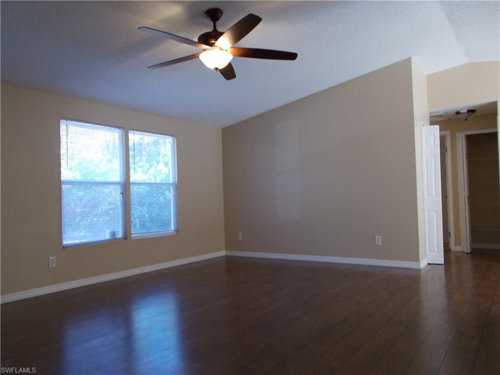 4180 Pine Ridge Road Naples, FL 34119 - Photo 4 of 25 VERY SPACIOUS LIVING ROOM AREA AS YOU ENTER YOUR NEW HOME