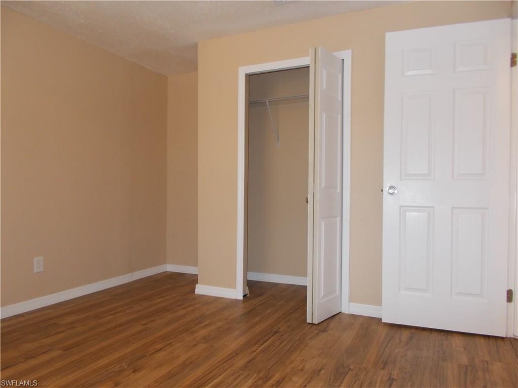 4180 Pine Ridge Road Naples, FL 34119 - Photo 5 of 25 GUEST BEDROOM IN THE FRONT OF THE HOME