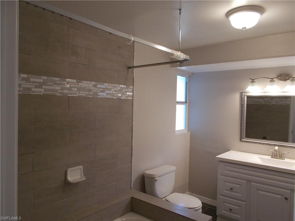 4180 Pine Ridge Road Naples, FL 34119 - Photo 7 of 25 GUEST BATHROOM THAT FEATURES MANY UPGRADES