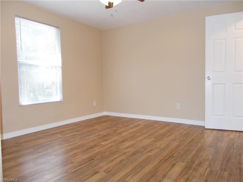 4180 Pine Ridge Road Naples, FL 34119 - Photo 10 of 25 SPACIOUS GUEST BEDROOM IN THE BACK OF THE HOME