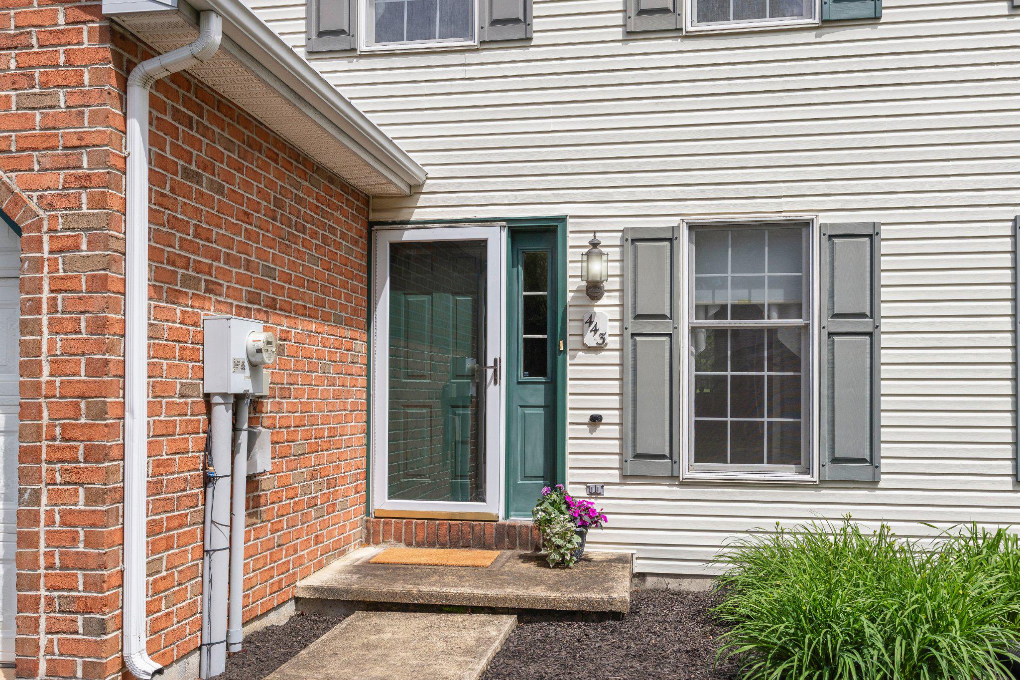 443 Crosswinds Drive Lititz, PA 17543 - Photo 3 of 26 a front view of a house with a yard