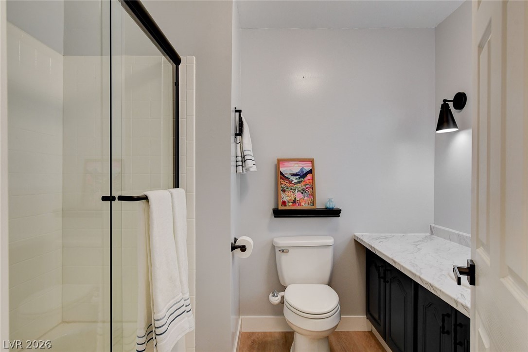 3765 Berkeley Street Logandale, NV 89021 - Photo 33 of 87 This sleek bathroom features a modern shower and vanity, offering both style and function.