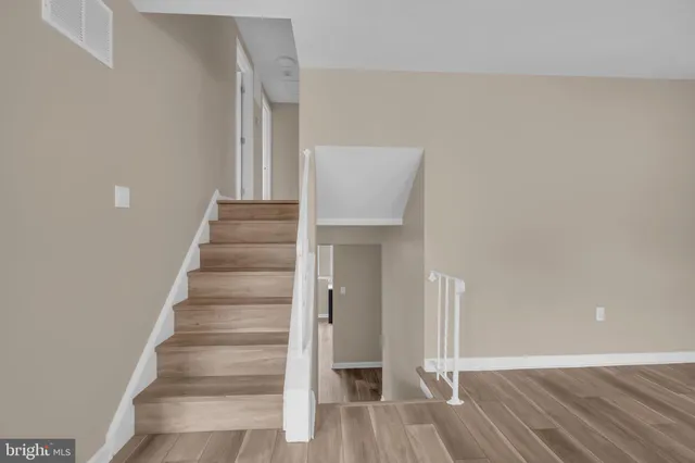 a view of entryway with wooden floor