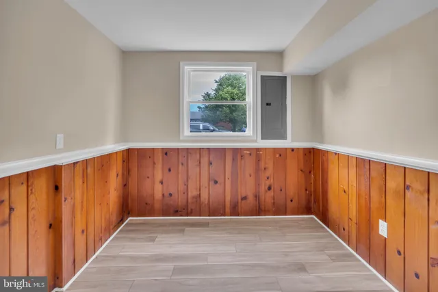 a view of a entryway with wooden floor and windows