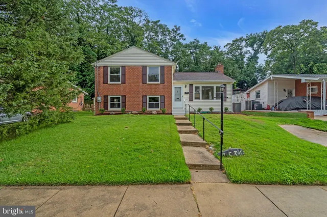 a front view of a house with yard