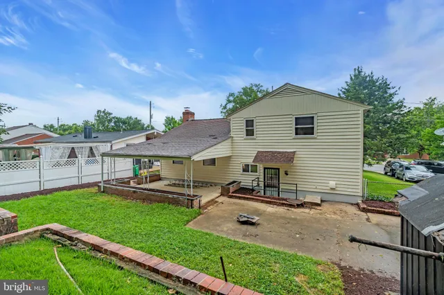 a view of a house with a yard porch and sitting area