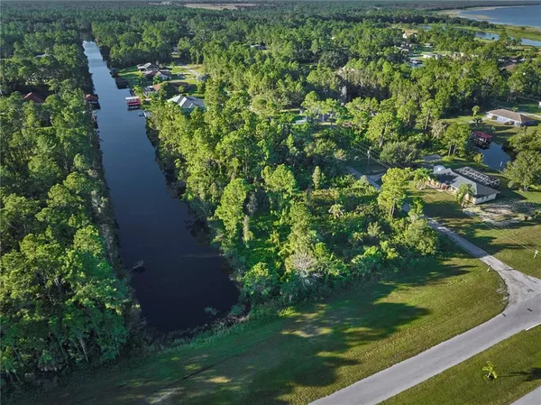 a view of a lake with a yard