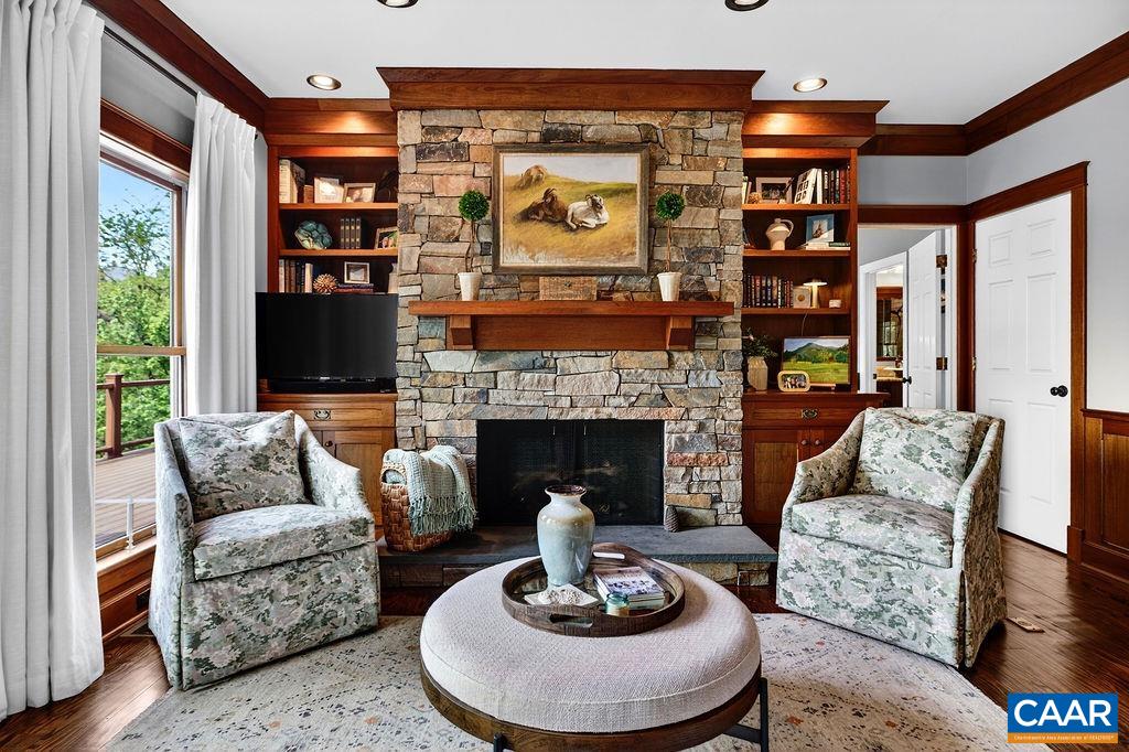 1059 Bryant Mountain Road Roseland, VA 22967 - Photo 12 of 58 a living room with furniture a fireplace and a large window