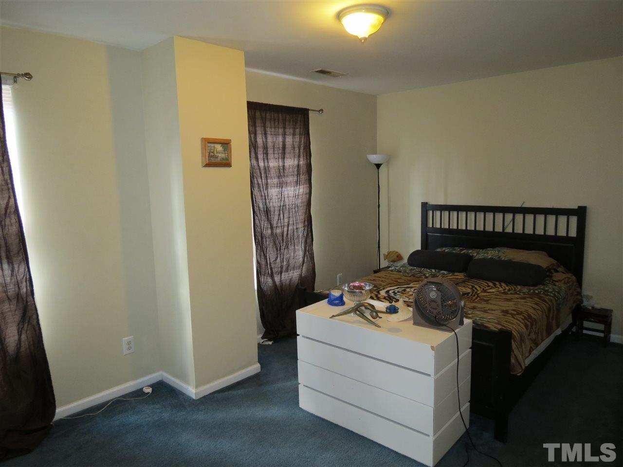 473 Dacian Road Raleigh, NC 27610 - Photo 6 of 10 a bedroom with a bed and a window