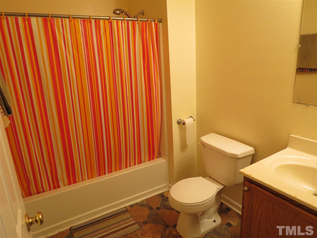 473 Dacian Road Raleigh, NC 27610 - Photo 7 of 10 a bathroom with a toilet and a sink