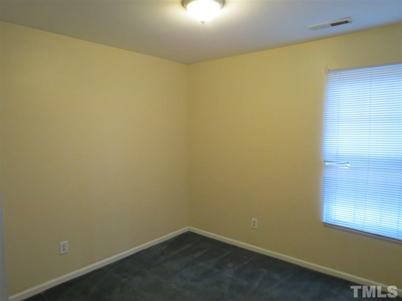 473 Dacian Road Raleigh, NC 27610 - Photo 8 of 10 an empty room with a window
