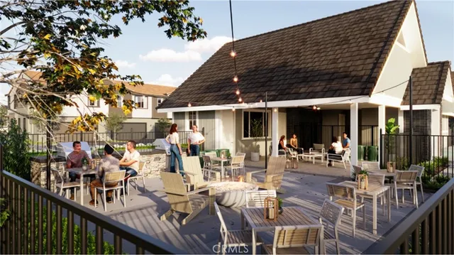 a view of a patio with couches table and chairs and potted plants