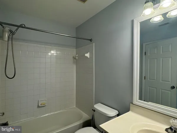 a bathroom with a toilet and shower