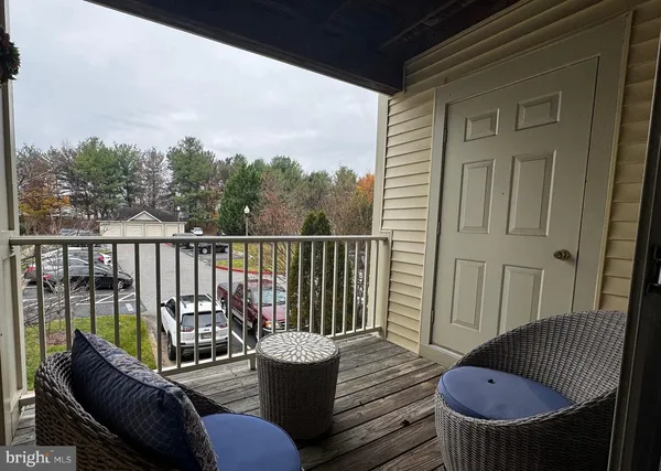 a view of balcony with furniture