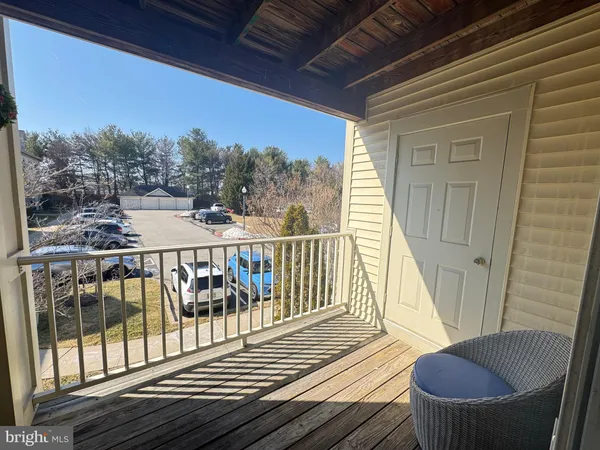 a view of a balcony with furniture
