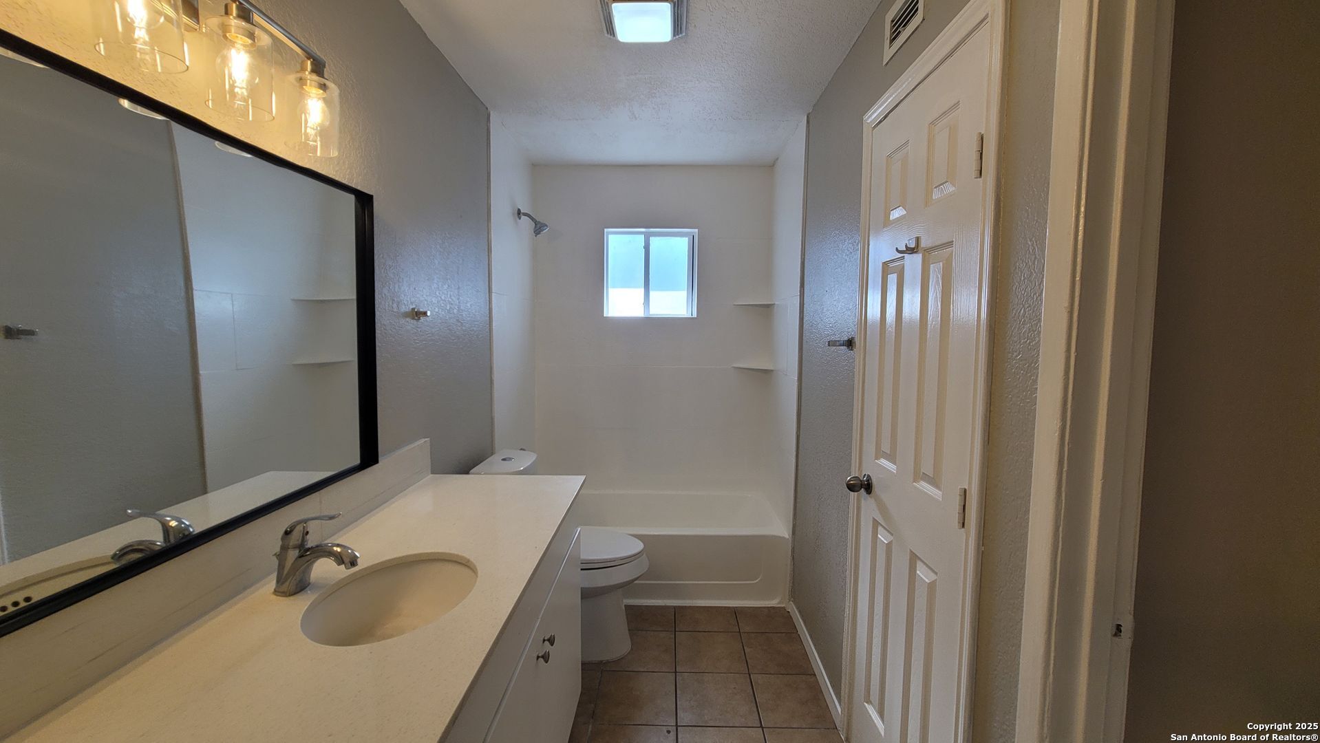 516 Gentleman Road, Unit 8 Balcones Heights, TX 78201 - Photo 13 of 33 a bathroom with a granite countertop sink and a mirror