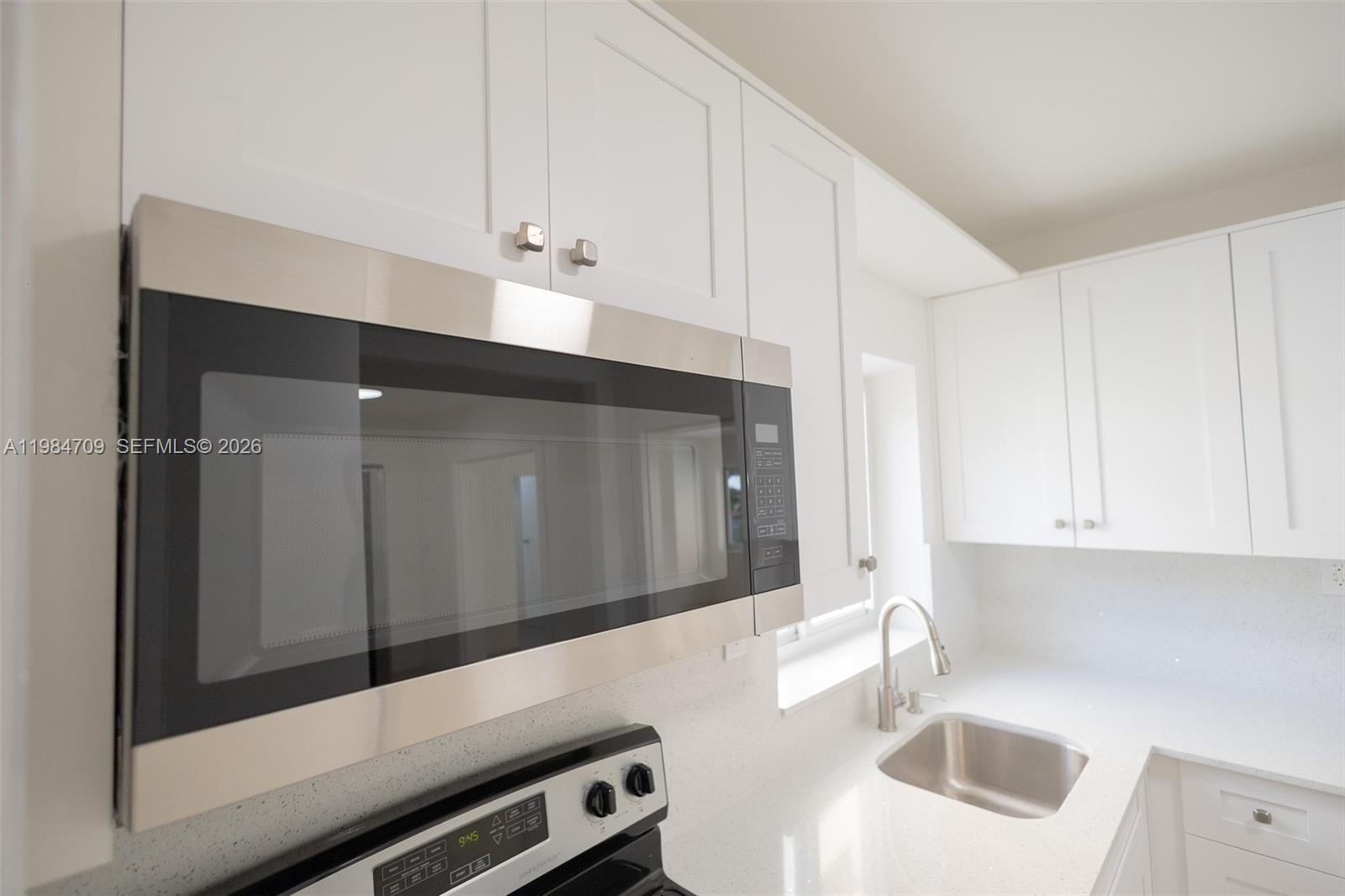 2675 Southwest 24th Terrace Miami, FL 33145 - Photo 11 of 36 a kitchen with a sink and cabinets