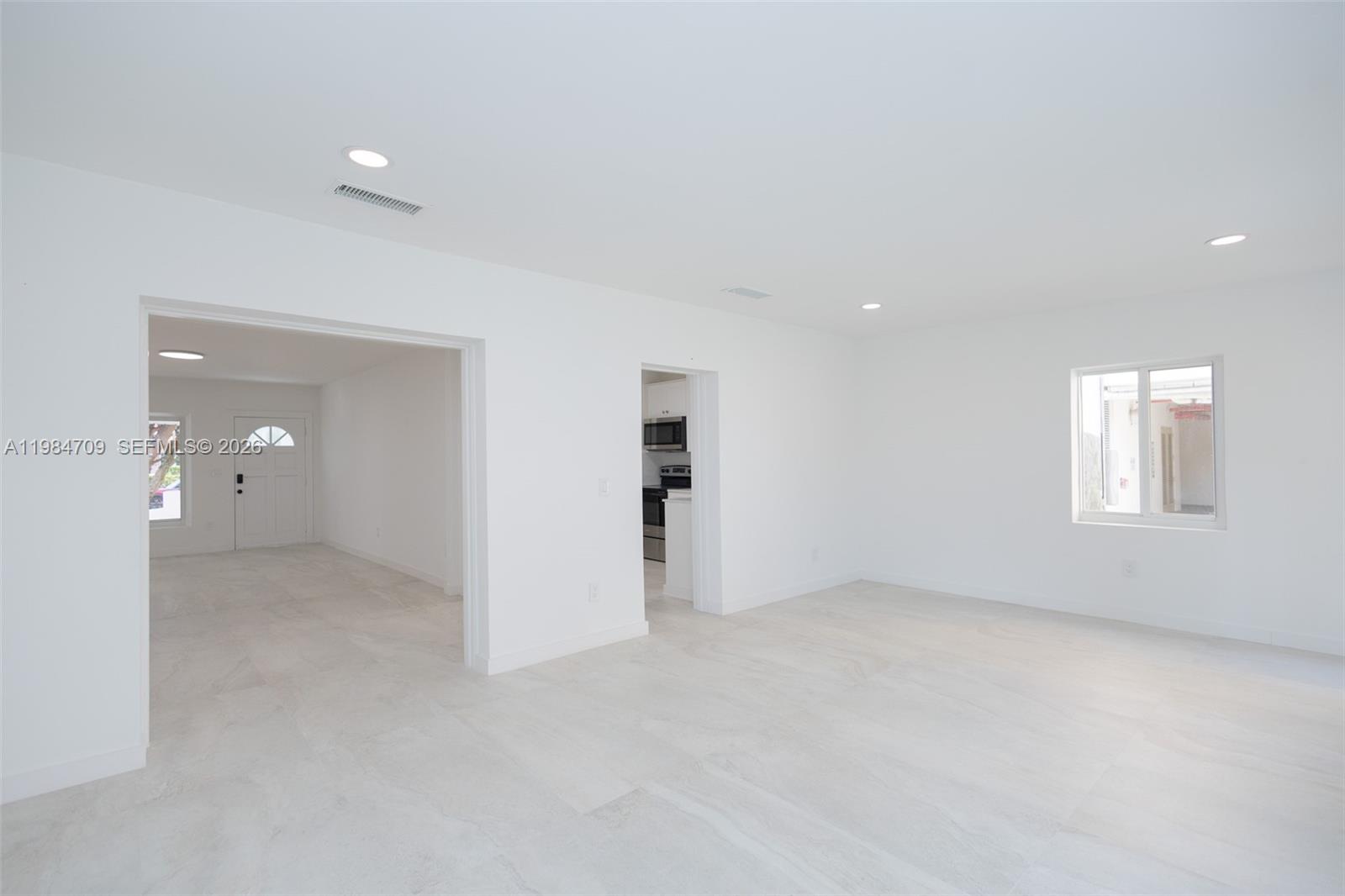 2675 Southwest 24th Terrace Miami, FL 33145 - Photo 16 of 36 an empty room with a bathroom and a window